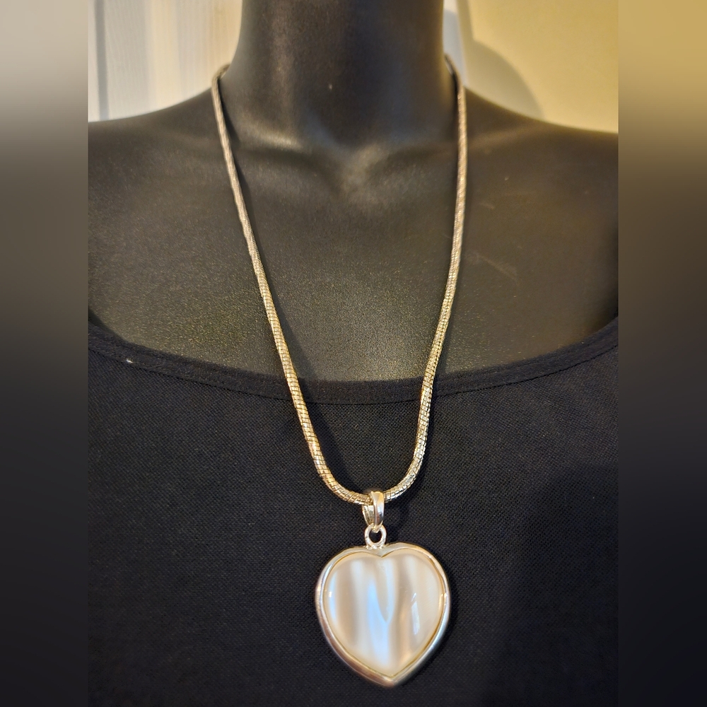 White Heart on a SilverTone Rope Chain.. Take a Peak